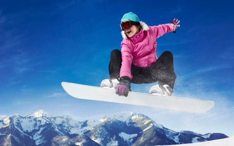 Snowboarder carving a turn on the slopes at Wolf Creek Ski Area