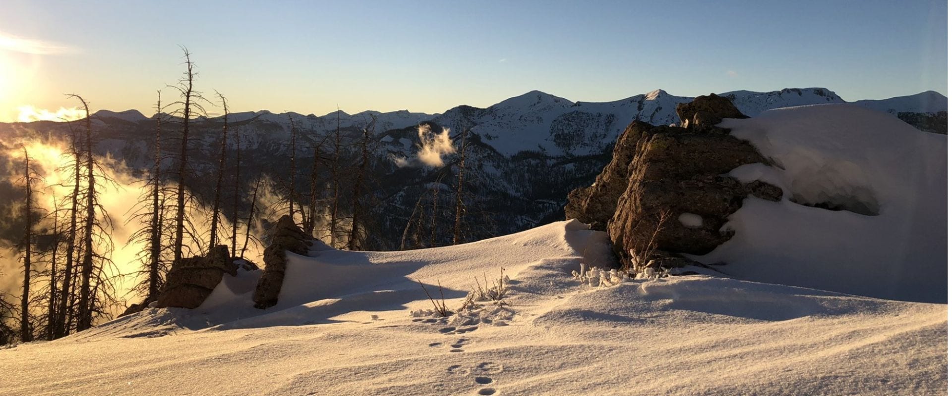 Golden-hour light over snowy San Juan Mountain ridges near Pagosa Springs