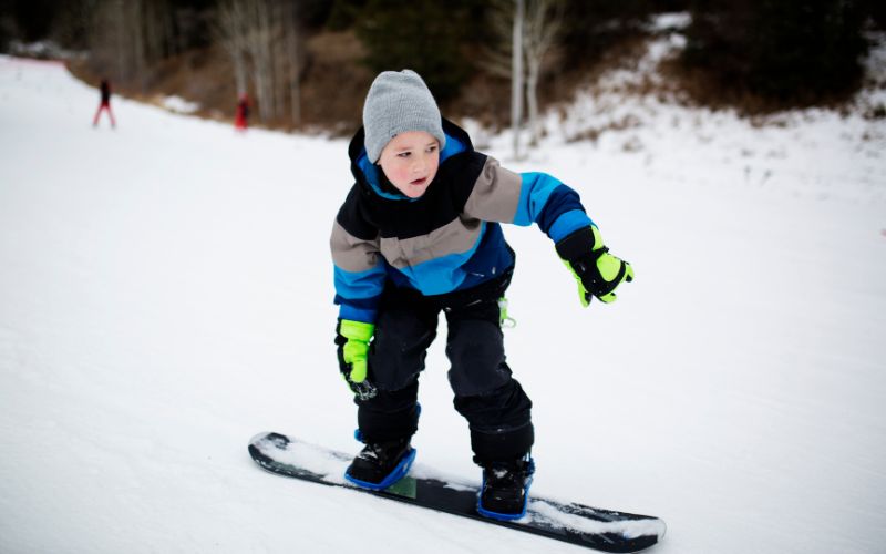 Young snowboarder enjoying the mountain at Wolf Creek Ski Area