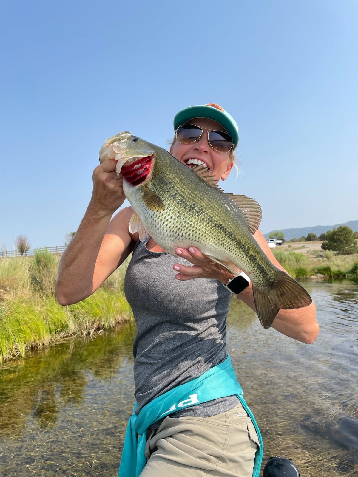Customer fishing catch — Ski & Bow Rack