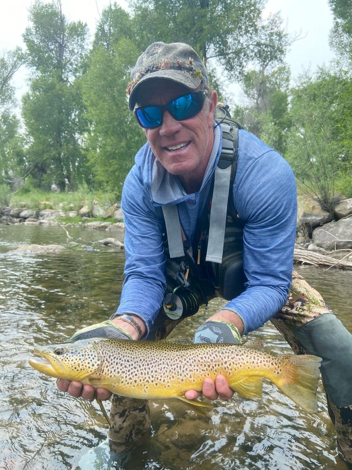 Happy angler with fish — Pagosa Springs fishing