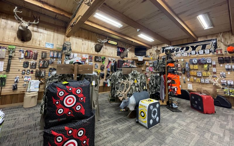Archery pro shop with targets, camo apparel, and bow gear at Ski & Bow Rack