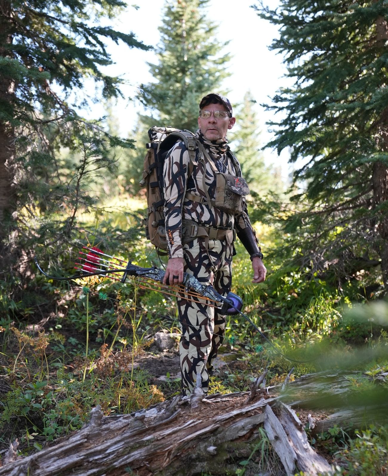 Camo hunter in the Colorado pines — bowhunting in the San Juan National Forest