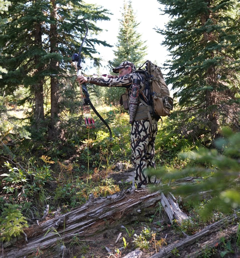 Ski & Bow Rack crew member with compound bow in the Colorado backcountry