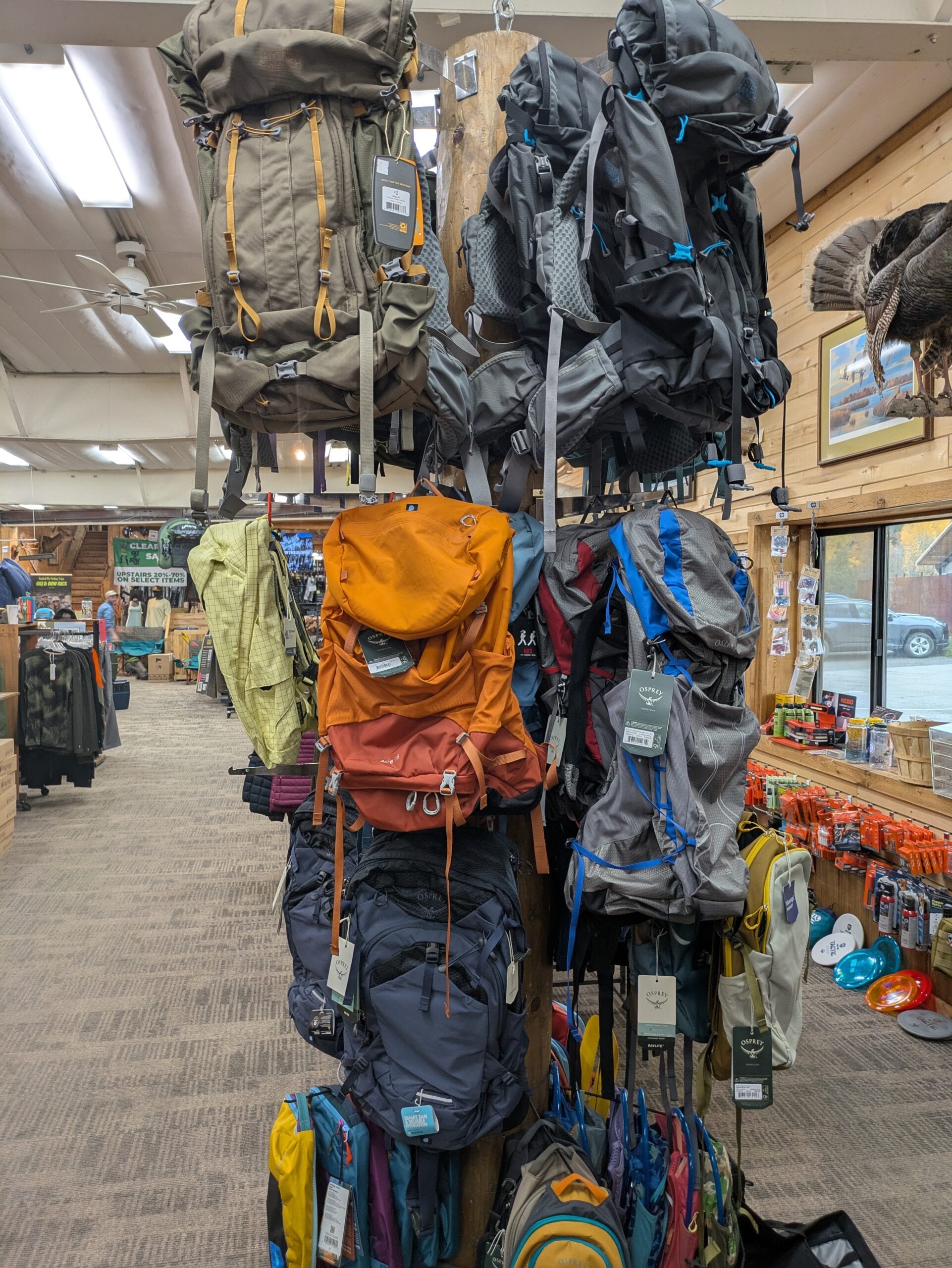 Outdoor clothing and accessories section inside Ski & Bow Rack